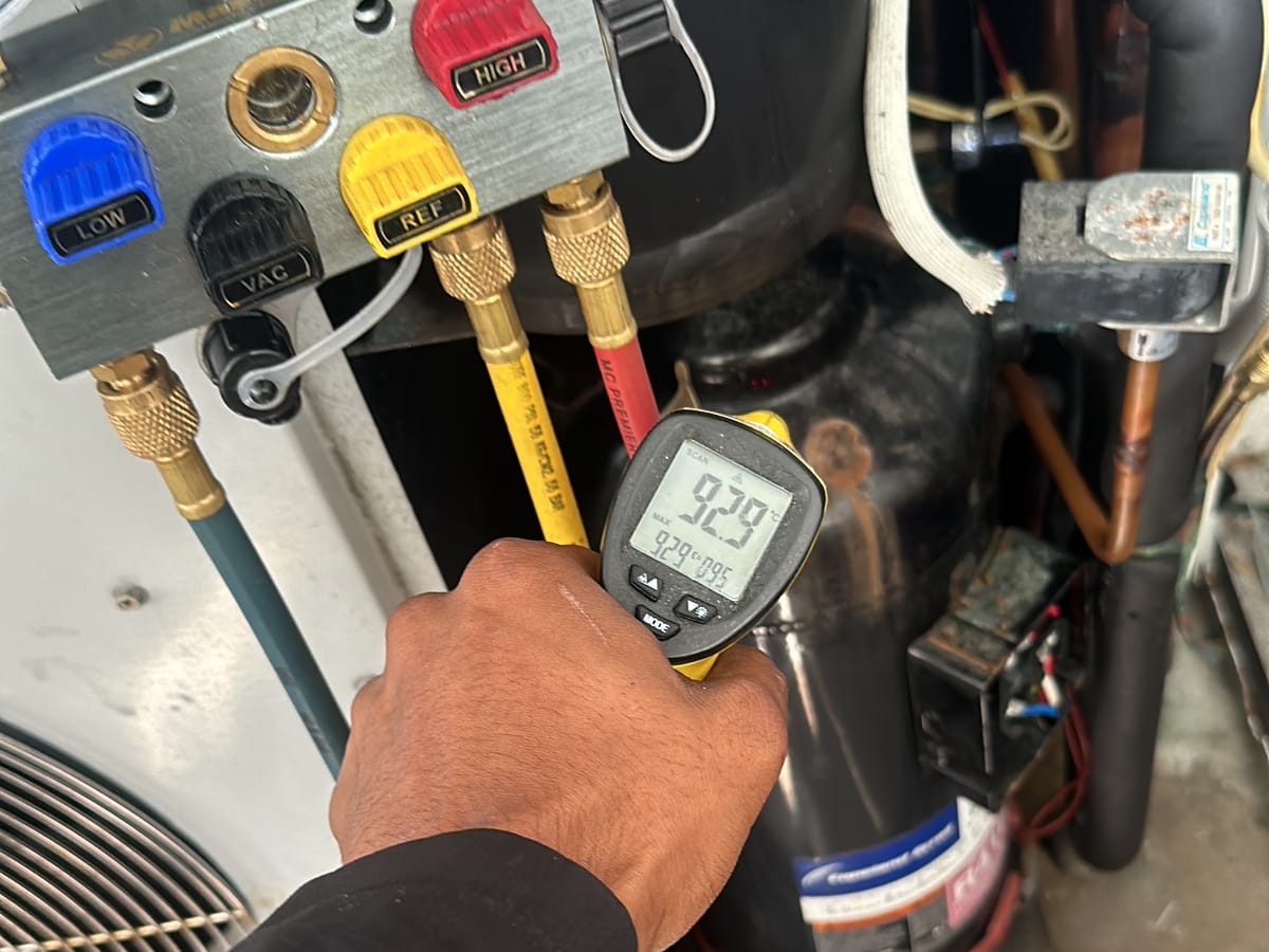 On-site diagnostics — refrigerant pressures and temperatures checked.